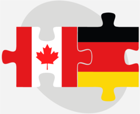 Die deutsche und die kanadische Flagge als Puzzleteilchen